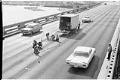 Image of Workers skidproofing 1st Avenue S. bridge, Seattle, March 23, 1964